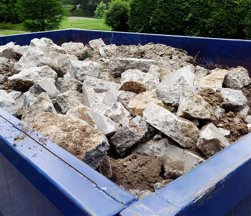 Dumpster full of concrete debris